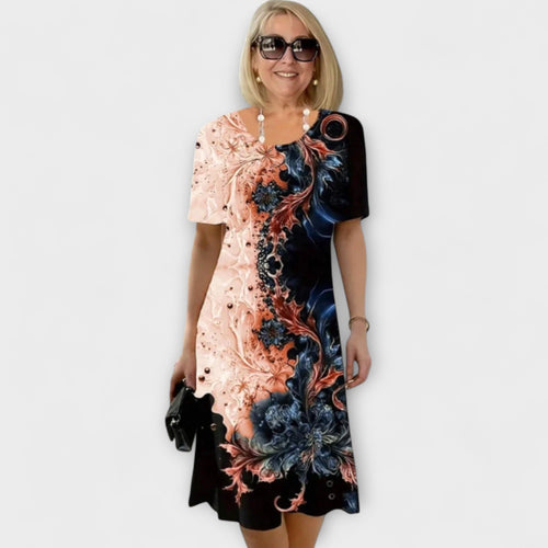 Anette - Svart-blå kjole med sommerblomstermønster