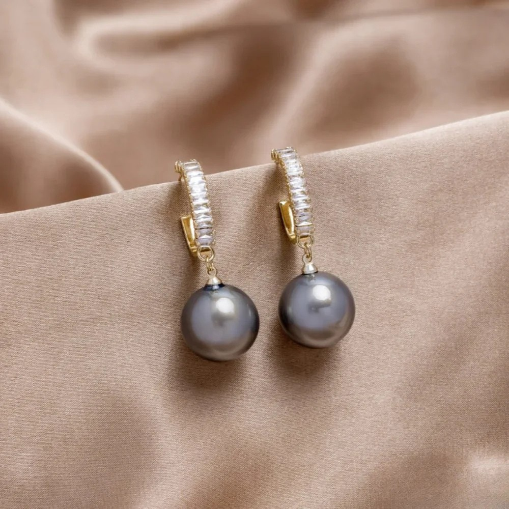 Iris - Elegante øredobber med perle-detaljer