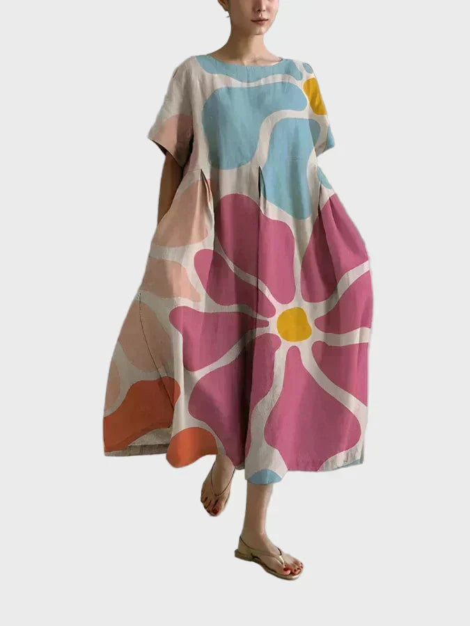 Ragnhild - Pastellkjole med stor blomst