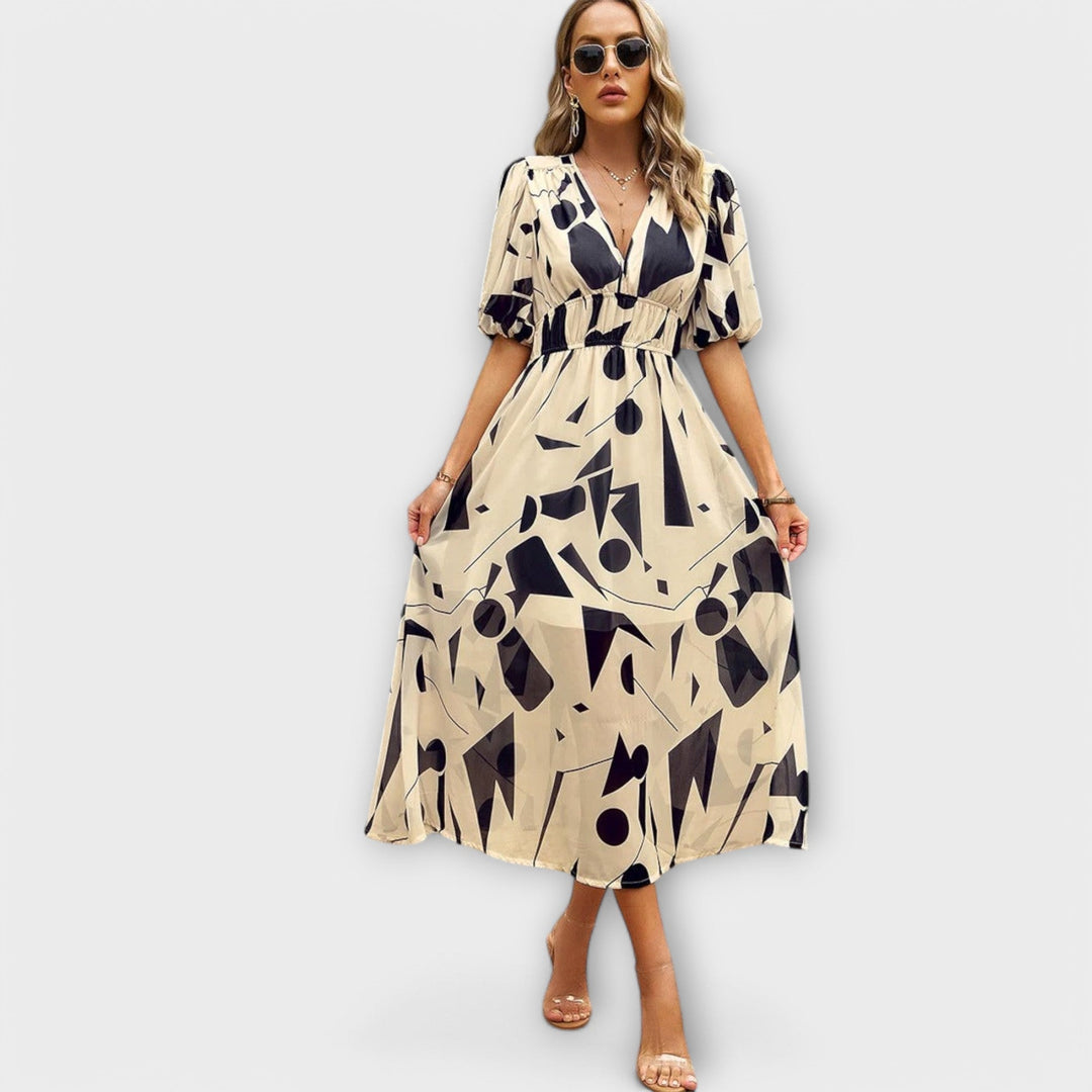 Idunn - Blue knee-length dress with floral pattern