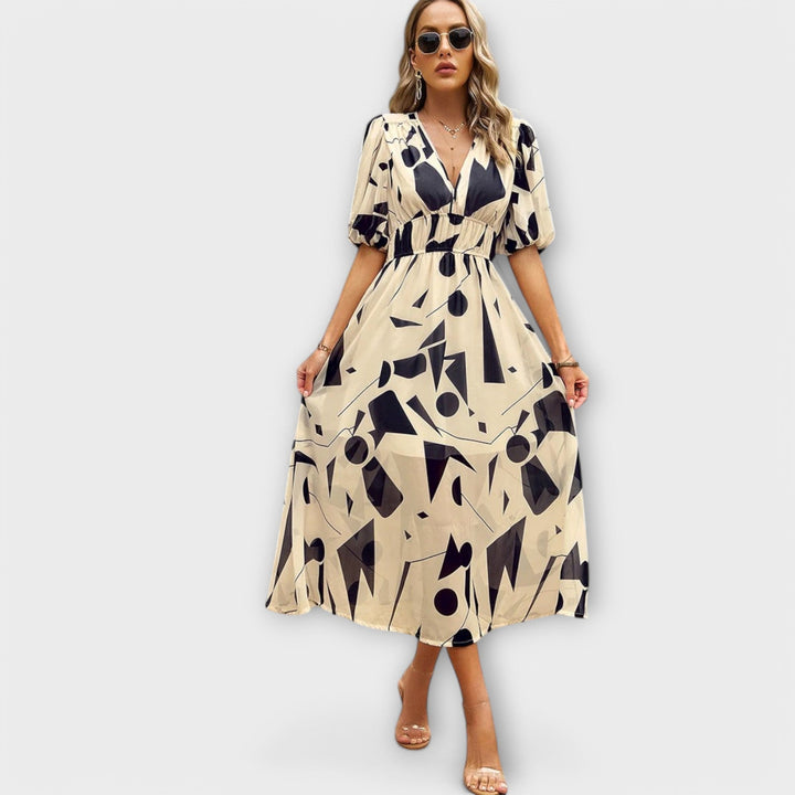 Idunn - Blue knee-length dress with floral pattern