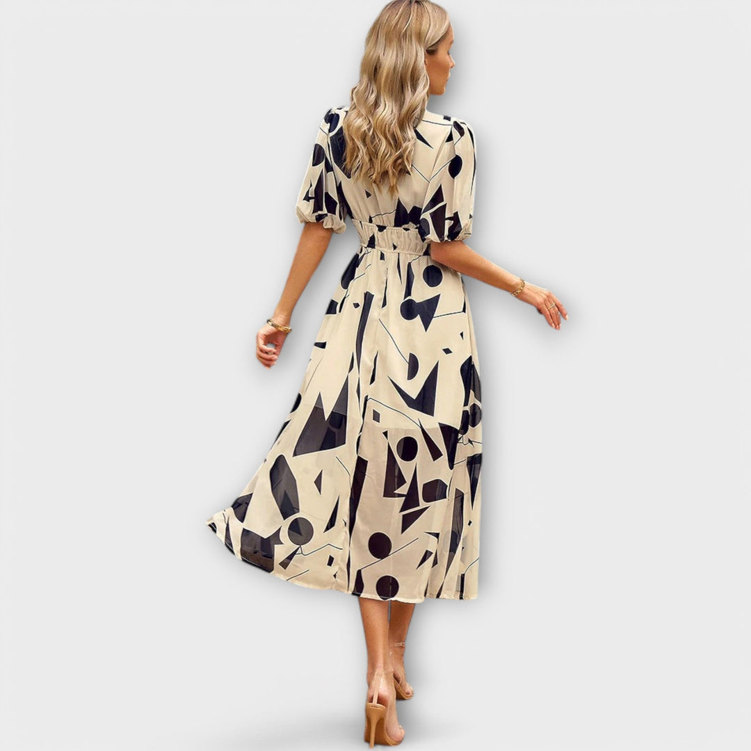 Idunn - Blue knee-length dress with floral pattern